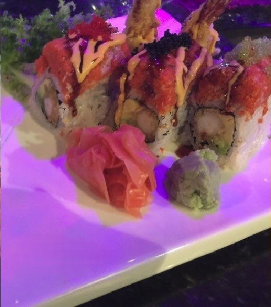 Specialty sushi rolls topped with spicy tuna and caviar